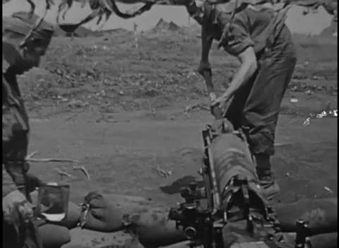 IWO JIMA, JAPAN - 1945: Muzzle work - Crewman Works at Howitzer Muzzle Видео 344503959