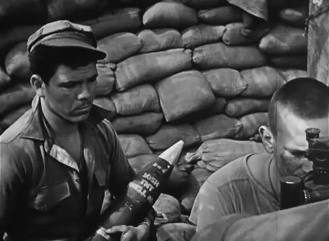 IWO JIMA, JAPAN - 1945: Shell preparation - Marines prepare a shell and fuze Stockbeeldmateriaal 344505131