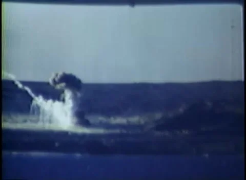 IWO JIMA, JAPAN - 1945: Shell splash - Tall water plume erupts near the shore Stock-Footage 344507149