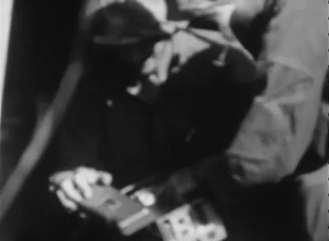 IWO JIMA, JAPAN - 1945: Technical inspection - Men bend over field equipment Stock Footage 344505969
