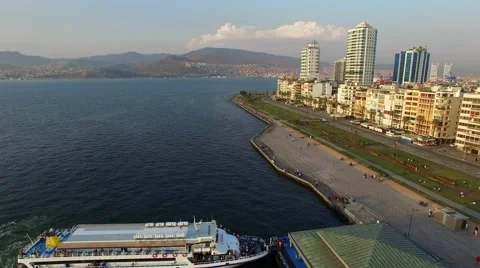 Izmir city center with coastline, ferries and fair. Turkish city, drone shot Stock Footage