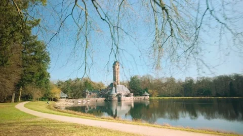 Jachthuis Sint Hubertus framed by tree branches in Hoge Veluwe Gelderland Stock Footage 303557536