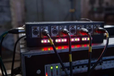 Jack and cable to the back of the light equipment. Stock Photos