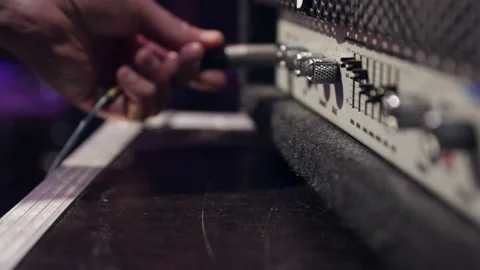 Jack audio connector in a socket on an audio device for music close up. Stock Footage 156505860