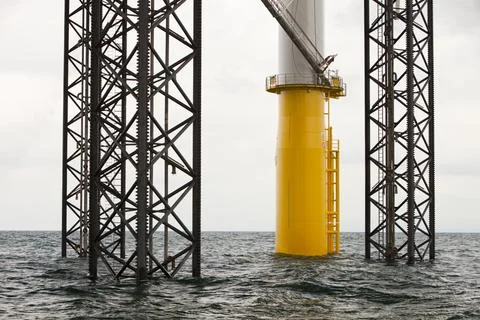 A jack up barge fitting wind turbines in the Walney Offshore windfarm project Stock Photos