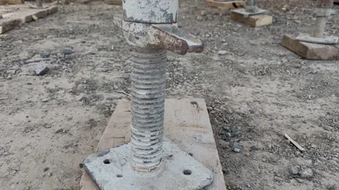 Jack base supports scaffolding in construction site closeup Stock Footage 240491955