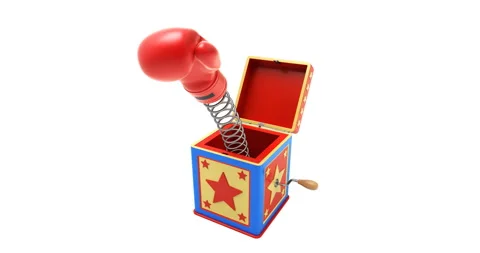 Jack in the box concept with a boxing glove jumping out from a box 動画素材 330932130