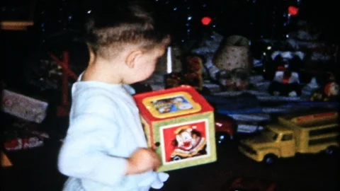 Jack in the Box surprises young boy on Christmas 1950s family home movie 4883 Stock Footage 93526583
