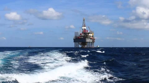 Jack up drilling rig in the middle of the ocean view from the crew boat Stock Footage 48096530