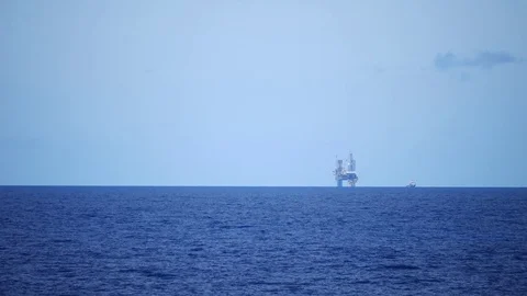 Jack up drilling rig in the middle of the ocean on sunny day Stock Footage 81202509