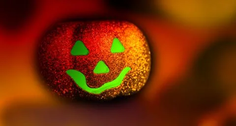 Jack Halloween lantern glowing from the inside. Bright multicolor background Stock Photos