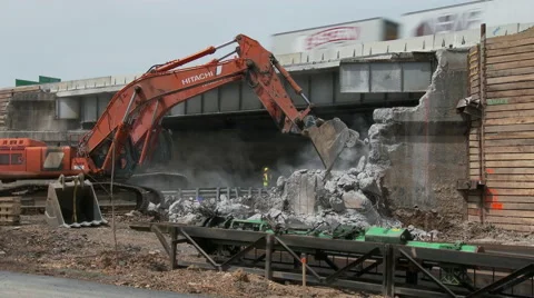 Jack-hammer deconstructs highway bridge abutment Stock Footage 49892549