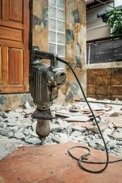Jack hammer machine break concrete floor for renovation Stock Photos