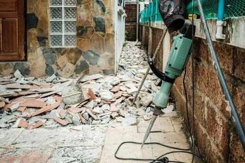 Jack hammer machine break concrete floor for renovation Stock Photos