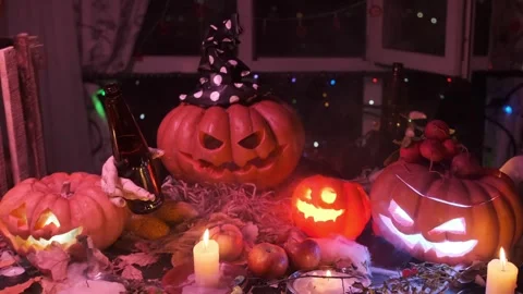 Jack lantern pumpkin glowing calls friends to party dancing with beer bottles Stock Footage 285497379