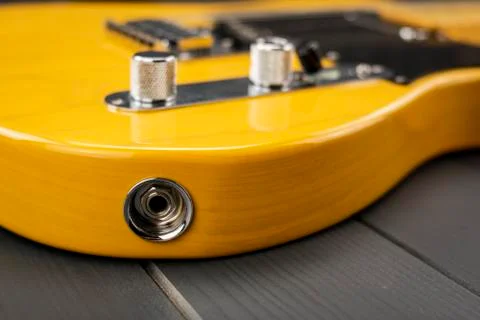 Jack line input of a classic yellow and lacquered American electric guitar wi Stock Photos
