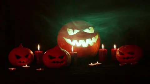 Jack-o-lantern with 3 creepy pumpkin.  Halloween. Stock Footage 141857666