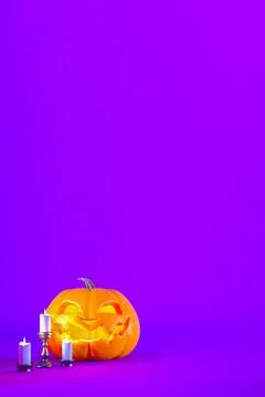 Jack o lantern and candles on purple Halloween background with copy space Stock Illustration