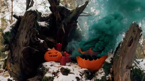 Jack-o-lantern blows smoke from his mouth and eyes. Halloween. Stock Footage 141857393