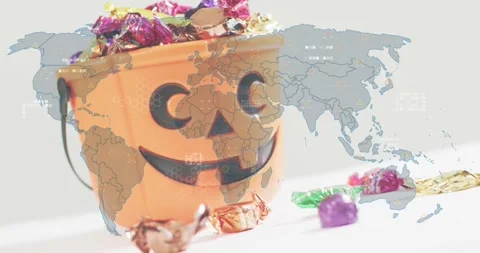 Jack-o'-lantern bucket receiving world map overlay triggers pulsing markers Stock Footage 317772391