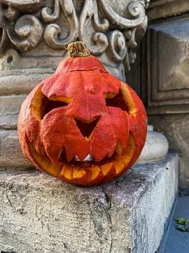 Jack-o'-lantern carved pumpkin with ghoulish face. Halloween tradition Stock Photos