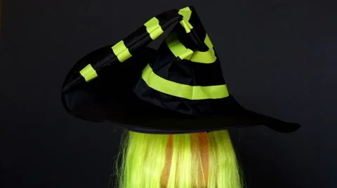 Jack-O-Lantern in the Dark Background in the wizard's hat 5. Looped Stock Footage 64974371