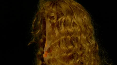 Jack-O-Lantern in the Dark Background in the red wig rotates 8. Looped Stock Footage 64974789