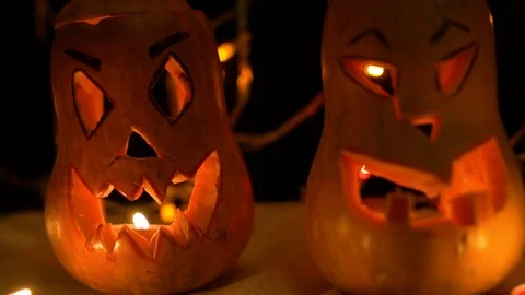 Jack-o'-Lantern decoration illuminating with burning candle inside. Autumn All S Stock Footage 118587101