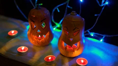 Jack-o'-Lantern decoration illuminating with burning candle inside. Autumn All S Stock Footage 118587169