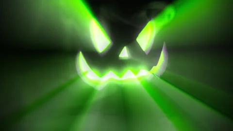 Jack O Lantern Face glowing green pulsing in the dark. Stock Footage 250465440