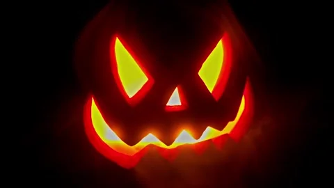 Jack O Lantern Face pulsing in the dark, Halloween intro or credit footage. Stock Footage 250465478
