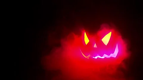 Jack O Lantern Face pulsing in the dark, Halloween intro or credit footage. Stock Footage 250465499