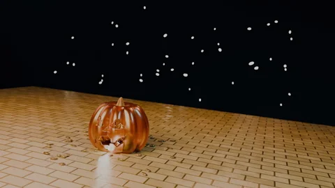 Jack-o'-lantern face with warm candle light on shiny golden bricks, 4K Stock Footage 346120353