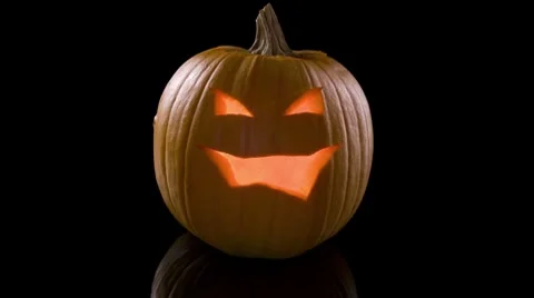 Jack-o-Lantern Flickering and Darkening Stock Footage