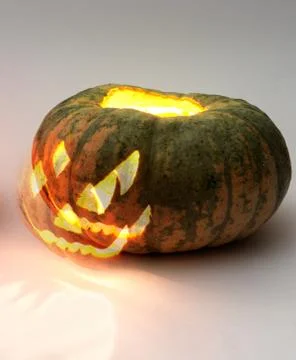 Jack o lantern. Ghost face separates Stock Photos