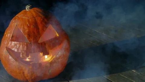 Jack O Lantern Halloween Pumpkin Blows Out Smoke Dark Background .Halloween Stock Footage 150105299