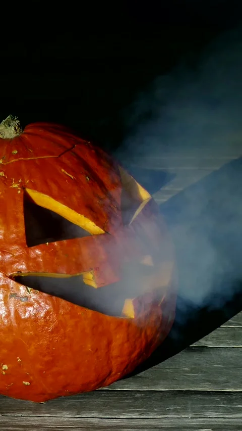 Jack O Lantern Halloween Pumpkin Blows Out Smoke Dark Background Stock Footage 299656358