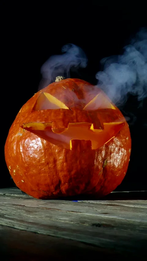 Jack O Lantern Halloween Pumpkin Blows Out Smoke Dark Background Stock Footage 299656440