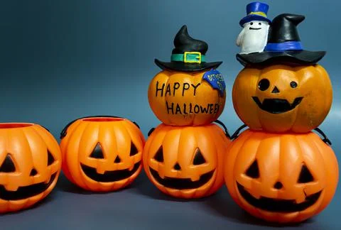 Jack o lantern pumpkin on a dark blue background Stock Photos