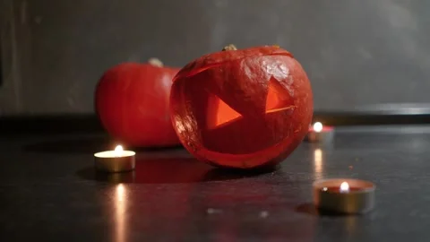 Jack-o-lantern pumpkin on Halloween glows. Decor holiday of ghosts, spirits Stock Footage 285262901