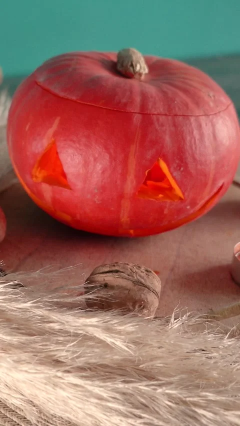 Jack-o-lantern pumpkin on Halloween holiday glows, with candles Stock Footage 286417131