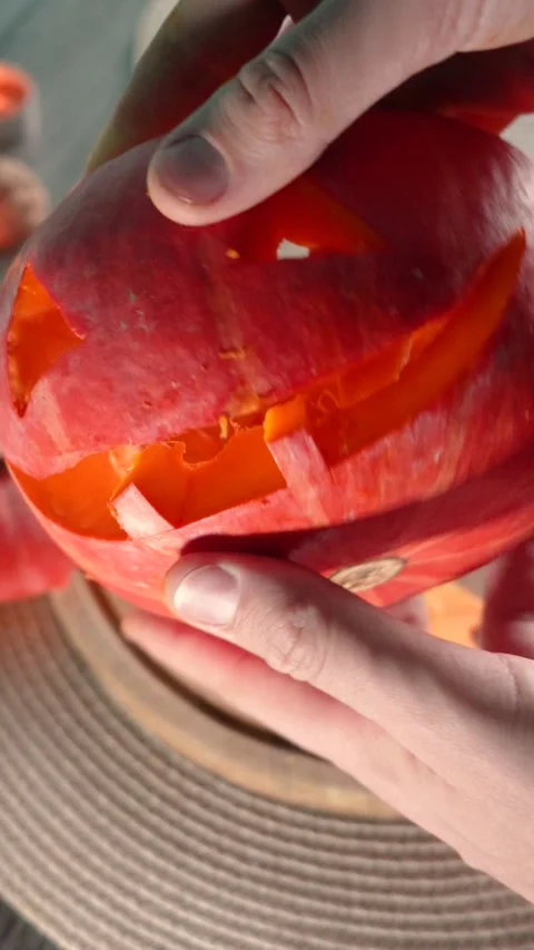 Jack-o-lantern pumpkin on Halloween holiday glows, with candles Stock Footage 286417412