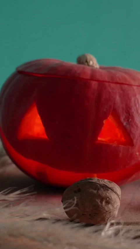 Jack-o-lantern pumpkin on Halloween holiday glows, with candles Stock Footage 286417796