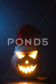 Jack-o ' - lantern scary shining eyes in the darkness Stock Photos