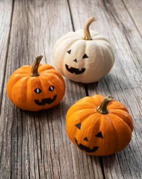 A jack-o-lantern set against an old tree Stock Photos