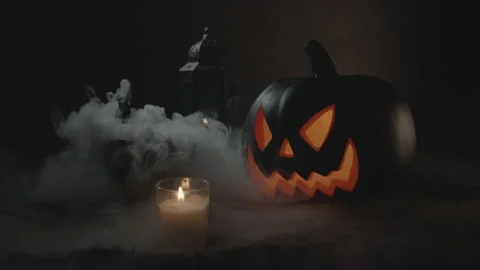 Jack-O-Lantern Surrounded in Fog Next to Steaming Cauldron | Halloween Stock Footage 138238892