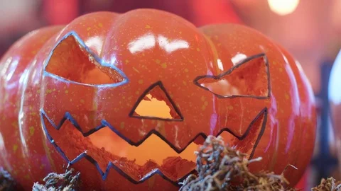 Jack-o-lantern on a table during a halloween party Video stock 107972222