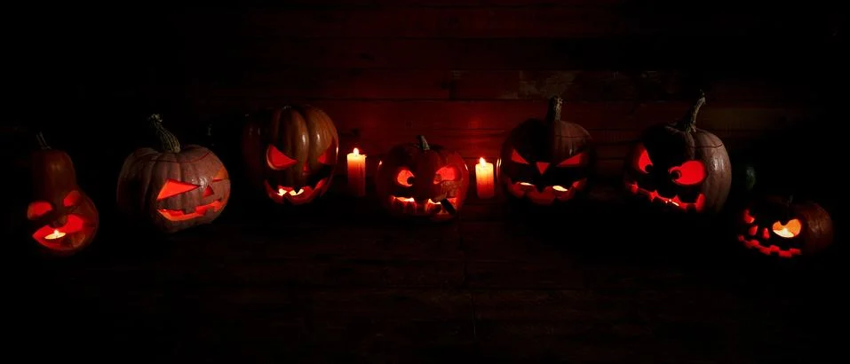 Jack-o-lanterns in a dark Photos