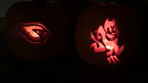 Jack-o-lanterns glow brightly in the early evening, Scottsdale, Arizona Stock Footage 117097589