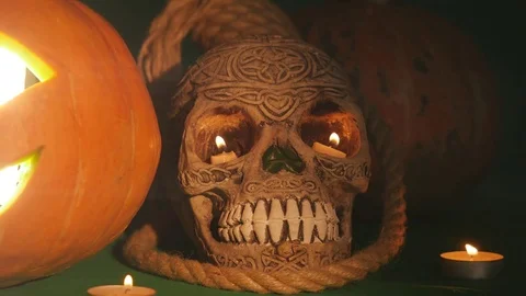 Jack o'latern and skull.This high definition footage would fit perfectly in any Stock Footage 81465315